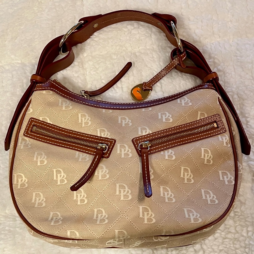 Dooney & Bourke Gold canvas shoulder bag with brown leather strap and red inside